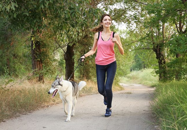 Girl Walking Dog - © theladders.com