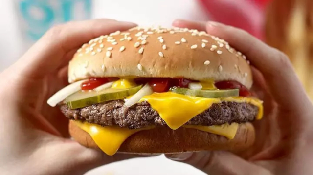 McPlant Burger in hands - © 2020 McDonald's via ladbible.com