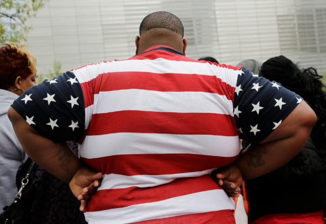 Fat American with Flag Shirt - © voanews.com
