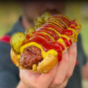 Hot Dog In hand - © 2025 Impossible Foods