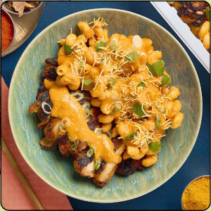 Butter Chicken Mac & Cheese - © 2026 Chimera Collective